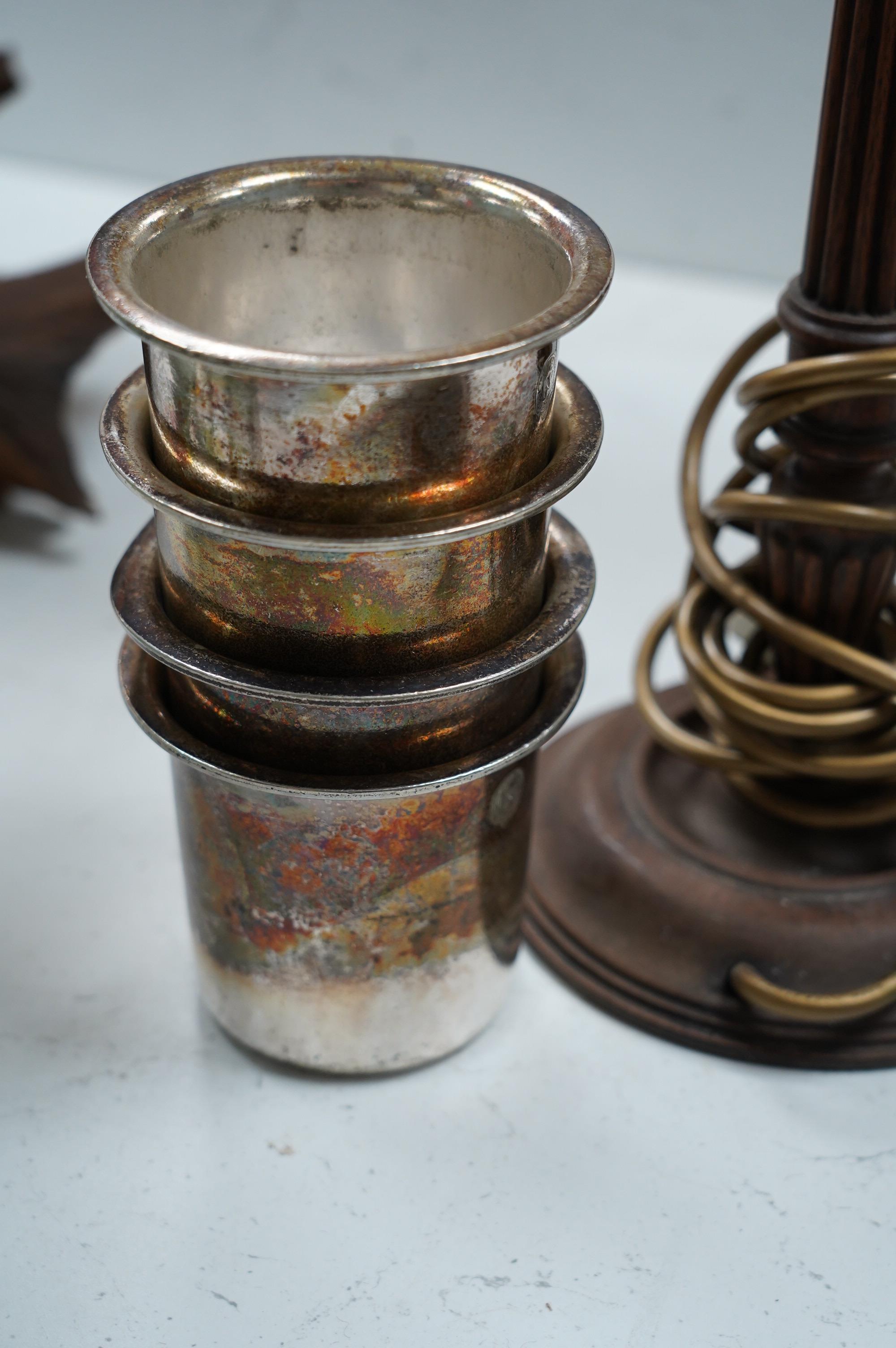 Shipping interest: Four George V Elkington Plate White Star Line beakers, date letters for 1921 & 1922, together with a lamp, tallest 55cm. Condition - poor to fair